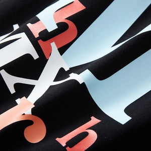 Men's loose black printed sports shorts with graphic lettering and high-quality jersey texture