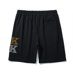 Men's loose black shorts with gold and silver rhinestone KK embroidery detail