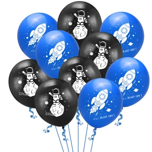 Close-up of astronaut and rocket latex balloons for outer space party decorations
