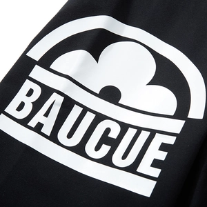 Black street style shorts featuring a bold white BAUCUE graphic print and relaxed fit