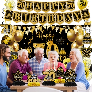 Macro detail of black and gold 70th birthday honeycomb table centerpieces and decor set