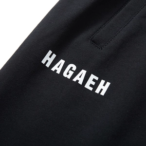 Men's loose black cotton sports shorts with white HAGAEH print on knit fabric