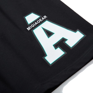 Men's loose black knit sports shorts with bold white A letter print and green outline