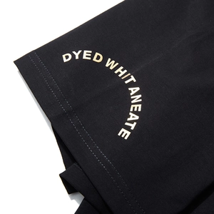 Men's oversized black T-shirt featuring premium gold letter printing on knit fabric