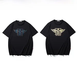 Detail of black T-shirt with metallic gold and iridescent reflective wing logo prints