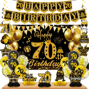 Complete black and gold 70th birthday party set with banner, balloons, and honeycomb centerpieces