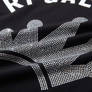 Oversized black cotton T-shirt featuring a sparkling rhinestone crown and bold text