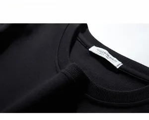 Detail view of the ribbed crew neck and 3XL size label on this black men's eagle sweatshirt