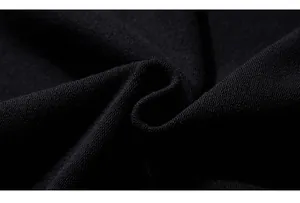 Macro shot of high-quality black knitted fabric texture with premium weave detail