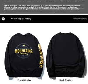 Flat lay of black crewneck sweatshirt with gold mountains graphic and sleeve print