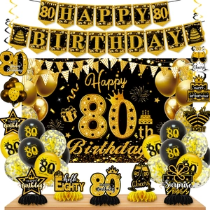 Detailed 80th birthday party set with black gold banner, balloons and table decorations