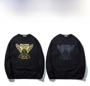 Detail of oversized black sweatshirt featuring dual angel wing prints with laser reflective finish