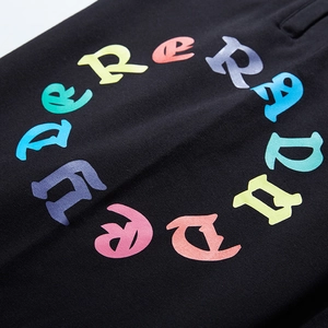 Men's loose jogger pants in black with colorful circular artistic letter print design