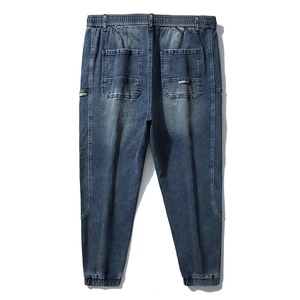 Men's blue washed denim joggers with elastic waist and ribbed cuffs back view