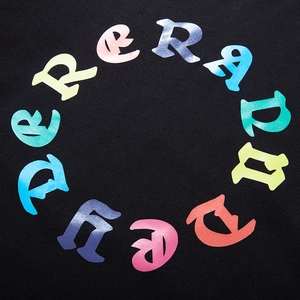 Close-up of black oversized sweatshirt featuring colorful gothic letter circle print