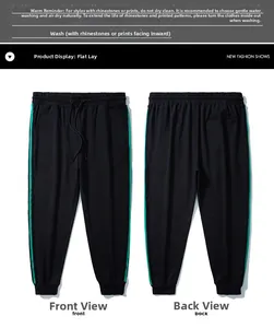Viste anteriore e posteriore dei pantaloni neri con strisce verdi e coulisse in vita