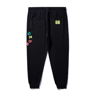 Black loose-fit jogger pants for men with colorful side lettering and elastic waist