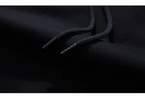 Detail of premium black knit fabric with modern perforated matte drawstring tips
