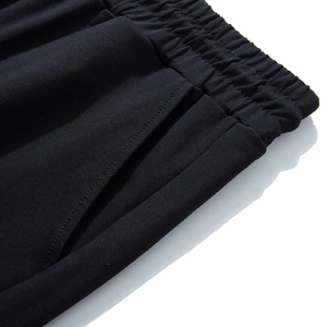 Men's plus size black jogger pants featuring an elastic waist and side pockets