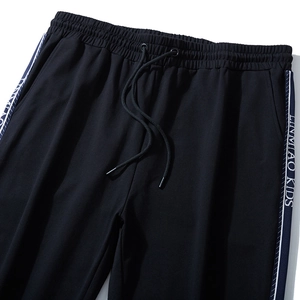 Men's plus size black jogger pants featuring elastic drawstring waist and side letter tape
