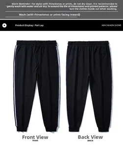 Détail du pantalon de jogging noir avec taille élastique et rayures blanches latérales