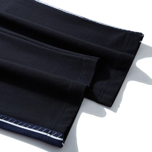Men's plus size black loose sports pants featuring side stripe details and thick fabric
