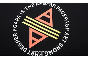 Close-up of geometric orange triangles and yellow stripes print on black cotton fabric