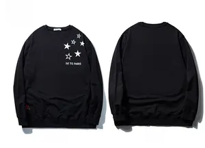Front and back view of a black oversized sweatshirt with white star pattern and letter print