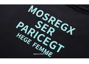 Detailed macro view of the premium black knit fabric with light blue graphic lettering