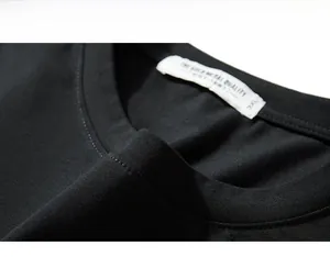Detail shot of black cotton t-shirt neckline showing quality stitching and size 3XL label