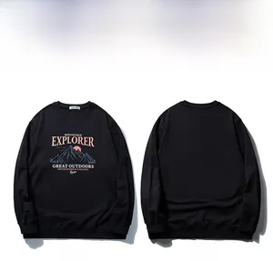 Flat lay of black plus size crewneck sweatshirt with Mountain Explorer graphic print