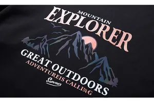 Close-up of Mountain Explorer graphic print on high-quality black cotton sweatshirt
