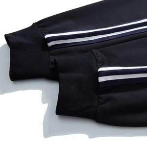 Pantalon de jogging noir ample pour homme avec bande latérale et chevilles côtelées