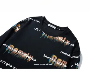 Detail of crewneck collar and vibrant graffiti print on black long sleeve sweatshirt