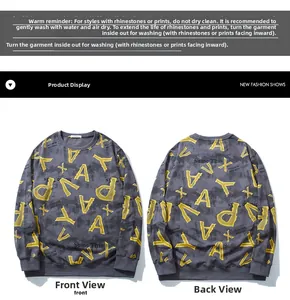Detailed view of yellow artistic letter print on dark grey streetwear sweatshirt