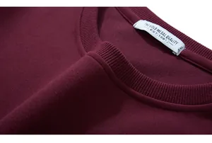 Detail of burgundy sweatshirt ribbed neckline with 4XL size label and quality stitching