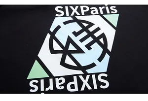 Detailed view of the SIXParis graphic print in mint green on black cotton fabric