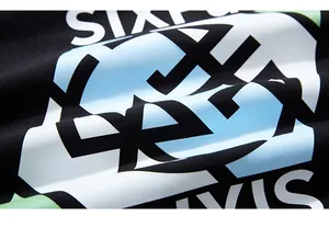 Macro detail of high-quality cotton fabric with vibrant geometric letter print