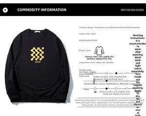Detail view of oversized black sweatshirt featuring gold Paris logo and material specs