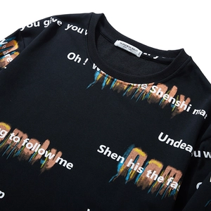 Men's oversized black crewneck sweatshirt featuring colorful graffiti and letter prints