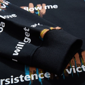 Men's oversized black sweatshirt sleeve with ribbed cuff and colorful graffiti print