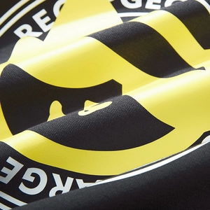 Black oversized knit hoodie featuring bold yellow and white glasses print graphics