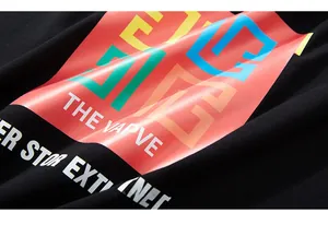 Macro shot of colorful geometric letters print on black cotton long sleeve T-shirt