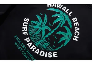 Close-up of teal palm tree print on black cotton fabric with Hawaii beach theme