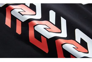 Close-up of red and white chain print on black knit cotton oversized joggers fabric