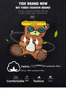 Detailed view of colorful bear embroidery and cotton blend fabric texture on black sweatshirt