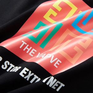 Men's oversized black long sleeve tee featuring vibrant colorful geometric graphic print