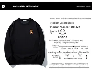 Detail view of oversized black sweatshirt featuring bear embroidery and fabric specifications