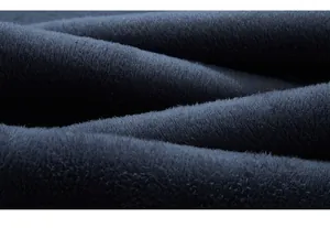Macro shot of deep blue winter-thickened fleece lining texture in stretch denim jeans