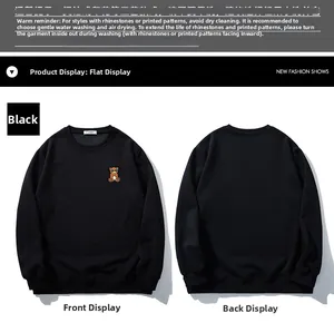 Front and back view of a black oversized sweatshirt with a small bear embroidery detail